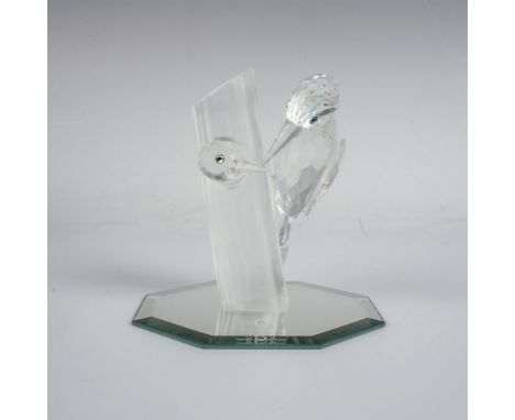 A clear faceted figure of wood pecking birds with iridescent eyes, perched and inside a frosted tree. Part of the 1988 Annual