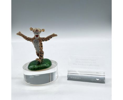 Limited edition jeweled figure with hand-set Swarovski crystal stones standing on green enameled base. Includes collectors di