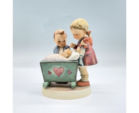 Hand painted figure of a girl and a boy looking at a baby in a cradle, their new sibling. Goebel backstamp. Dimensions: 4.25"