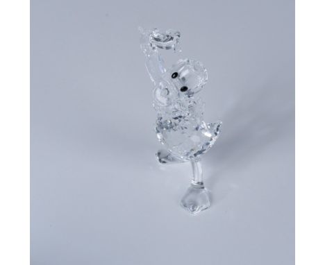 A clear Donald Duck proudly holding his hat with a broad smile, accented with black and white crystals for his eyes. Swarovsk