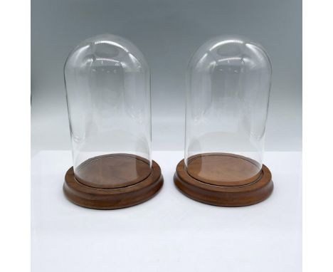 Two glass dome display cases with wooden bases. Wood is a light mahogany color. Each measures 7.5"H x 5.25"dia. Issued: 21st 