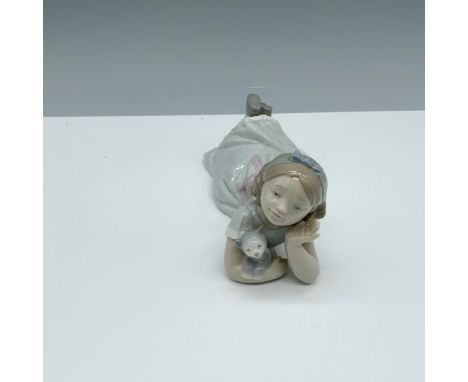 Glossy figure of a young girl laying down with her cat. Lladro backstamp. This item has its original box (4.75"L x 4.5"W x 8"