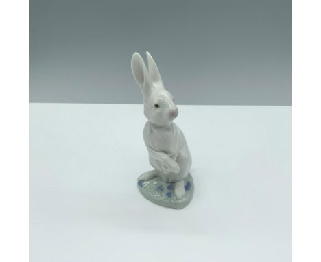-Glossy figure of a bunny ready to prance around. Lladro backstamp. This item has its original box. Box dimensions are 8"L x 