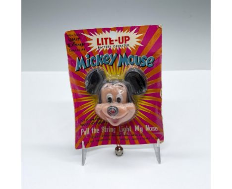 Vintage hand painted clip-on toy with a pull string to light Mickey's nose. Mickey stored in original packaging. Measurement 