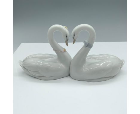 Glossy figure of two swans forming a heart with their necks. Lladro backstamp. This item has its original box. Box dimensions