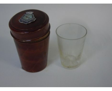 Wooden cased antique glass measure with enamel crest to top 