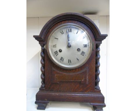 OAK CASED BRACKET CLOCK WITH BARLEY TWIST COLUMNS