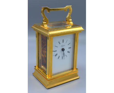 A 20th Century Heavy Brass Carriage Clock, the enamel dial with Roman numerals and inscribed Angelus and with lever escapemen