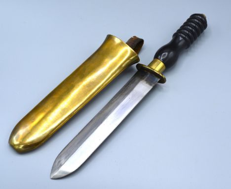 A Divers knife by Siebe Gorman and Company with brass guard, moulded handle and brass scabbard, 45cms long 