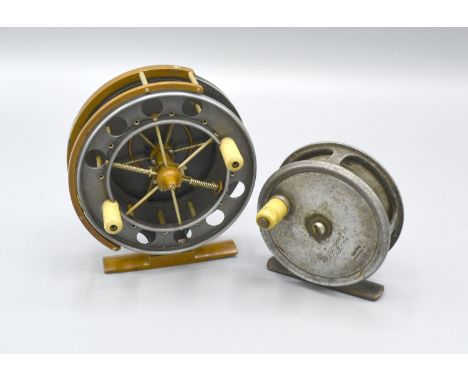 An Army and Navy fishing reel, 9cms diameter, together with another similar by Army and Navy, 7cms diameter 