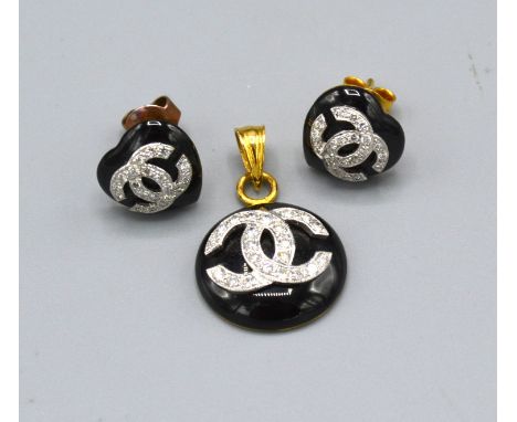 An 18ct yellow gold and enamel diamond set pendant together with a matching pair of 14ct gold heart shaped enamel and diamond