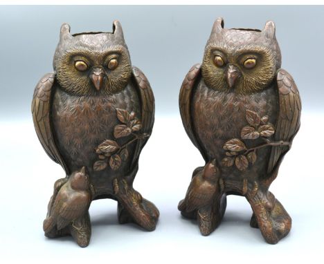 A Pair of 19th Century Patinated Bronze Vases in the form of owls upon a branch with bird at foot, 19 cms tall 