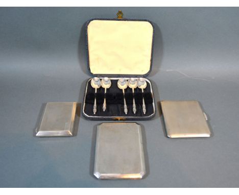 A Birmingham silver cigarette case with engine turned decoration together with two similar Birmingham silver cigarette cases 