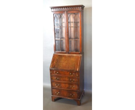 A 20th Century Mahogany Bureau Bookcase, the moulded cornice above two astragal glazed doors, the lower section with a fall f