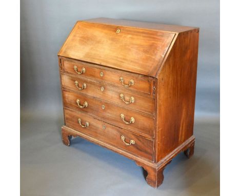 A 19th century mahogany bureau, the fall front enclosing a fitted interior above four long drawers raised upon bracket feet, 