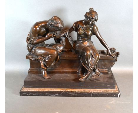 A 20th century patinated bronze group in the form of two classical figures on a bench, bearing signature Claudion, 42cms long