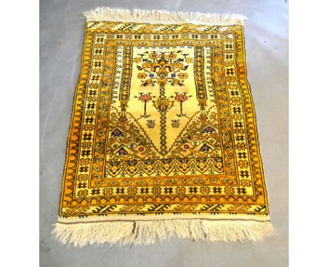A North West Persian Woollen Prayer Rug with an all-over design upon a cream ground within multiple borders, 110 x 87 cms 