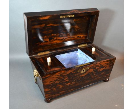 A 19th century coromandel tea caddy, the hinged cover enclosing a blending bowl and two compartments 