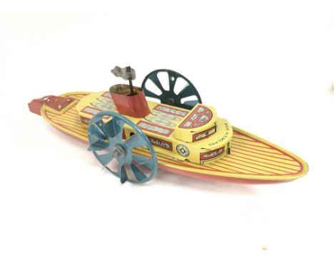 A Wells Brimtoy tinplate Clockwork paddle Boat. #70