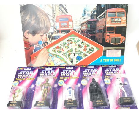 A Box Containing a Collection of Rose Art Star Wars Stampers. And a Merit Remote Control Driving School.