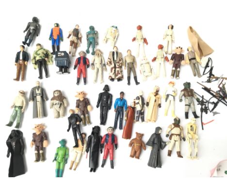 A Box Containing A Collection of Vintage Star Wars Figures and some wepons.