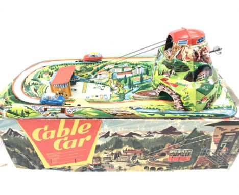 A Boxed vintage German Wind up Tin plate Cable Car. By Technofix.