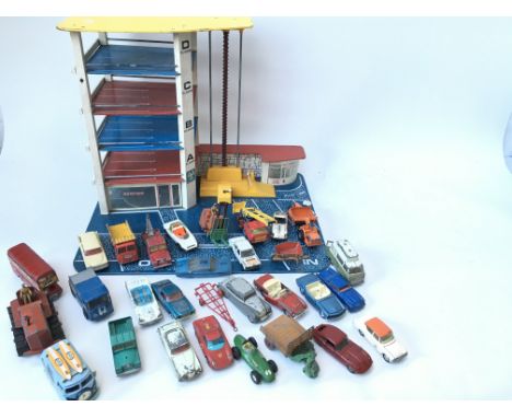 Collection of various vintage Playworn vehicles including Corgi and dinky. Also 60/70â€™s garage.