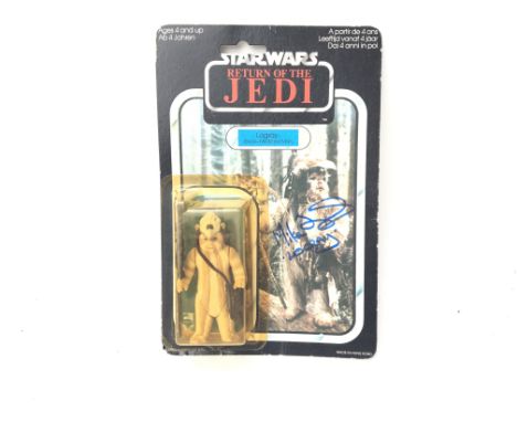 A vintage Star Wars return of the Jedi Logray carded action figure. Signed by actor Mike Edmonds who featured in two of the o