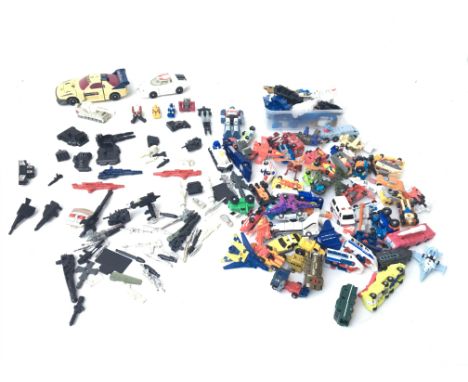 A collection of microbots and vintage transformers figures and accessories.