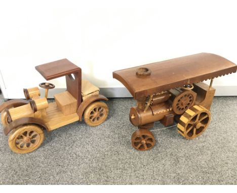 2 Wooden Vehicles including a vintage Car 21 cm in height and a Steam engine 22cm in height.