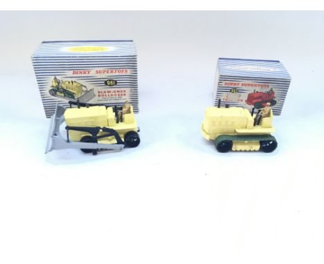 A pair of boxed Dinky vehicles including a 961 Blaw-Knox bulldozer and a 963 Tractor. Track on both perished.