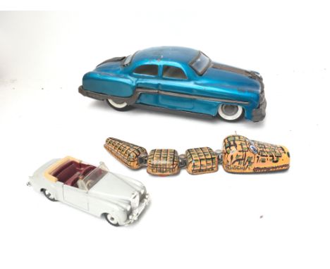 2 X Tinplate toys. A Clockwork crocodile and a friction rock and Roller with a Dinky Bentley.