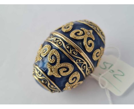 A gilt enamel and paste egg