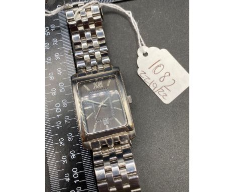 A gents rectangular lack faced wrist watch by SEKONDA with seconds sweep and date aperture W/O