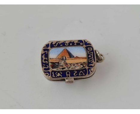 A early 20th century silver and enamel Egyptian revival charm of Moses in a basket
