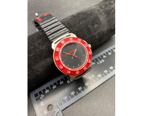 A black and red dial gents wrist watch by NEWS WEEK with seconds sweep W/O