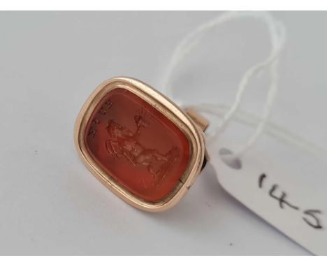 GEORGIAN CARNELIAN SET FOB SEAL WITH AN INTAGLIO OF A CHERUB HOLDING A LAMP WITH THE WORD “HUSH”