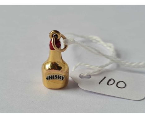 A gold and enamel bottle of whiskey charm 9ct