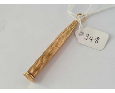 A 9ct cigar piecer in engine turned pendant case     10 gms