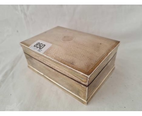 A cigarette box with engine turned cover with vacant cartouche, 5" wide, Birmingham 1926