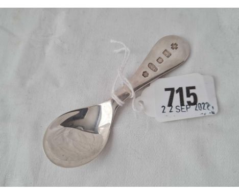 A Millennium caddy spoon, 4" long by RC