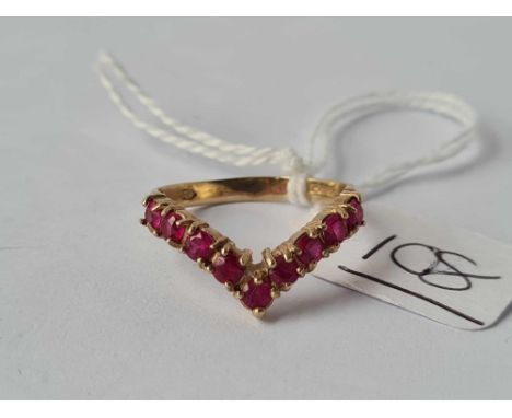 A ruby wish bone ring 9ct size P   2.4 gms