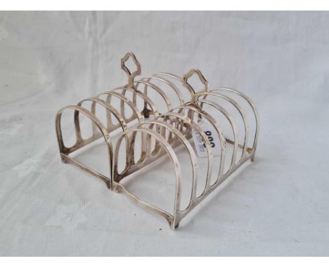 A pair of seven bar toast racks on bracket feet, 4.5" wide, Birmingham 1945, 162g