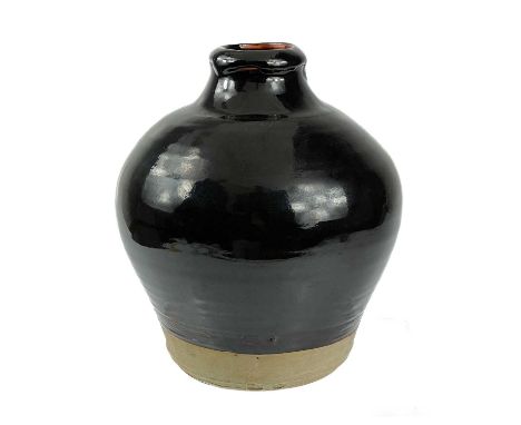 Bernard LEACH (1887-1979) A jar  An early stoneware jar with tenmoku glaze above a biscuit band at the foot, early script sea
