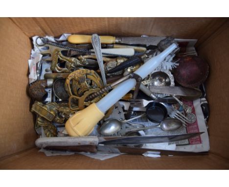 A mixed lot of silver plated flatware including berry spoons, meat servers, a tea strainer, a nut cracker, with a cricket bal