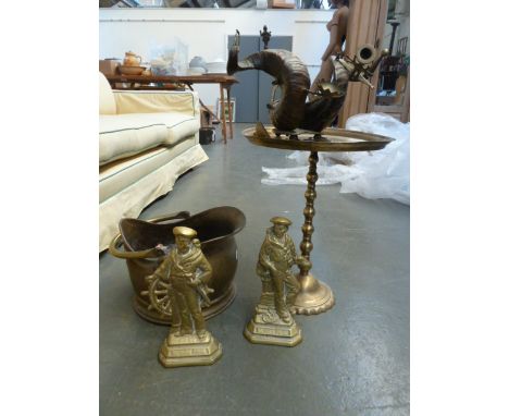 A brass coal scuttle, wuith two brass sailor door stops, a brass table and an Indian desk ornament