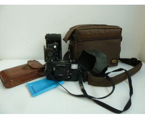 An Ensign Carbine No7 (F22948) box camera with fitted and lined leather carry case; together with a Konica C35 AF 35mm camera