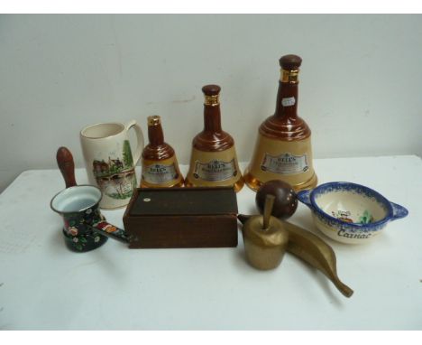 Three Wade Pottery Bell's Whiskey decanters in the form of bells - small medium and large in size, various pieces of wooden f