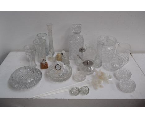 A quantity of glassware including a decanter and stopper, a large condiment jar and cover, six coasters, a condiment set incl