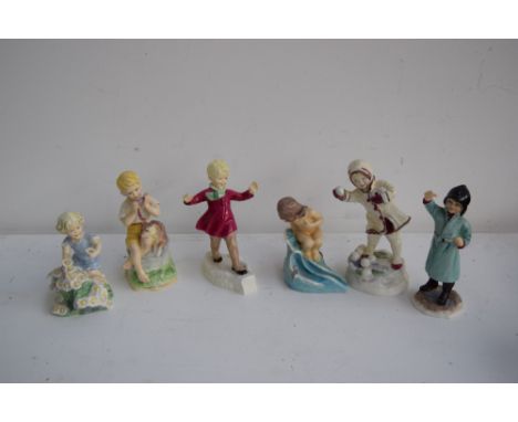 A quantity of Royal Worcester 'A Child's Blessing' series figurines including 'Mondays Child...', 'Tuesdays Child...' both bo